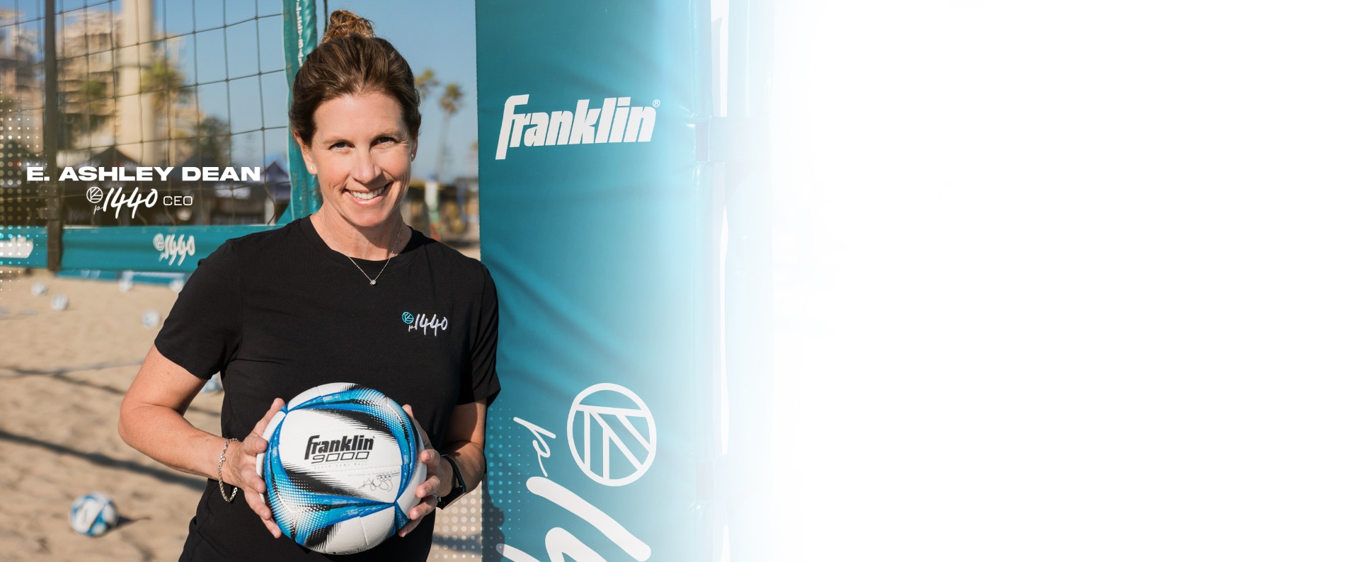 E. Ashley Dean, CEO of p1440 holds Franklin's new 9000 Game Beach Volleyball.