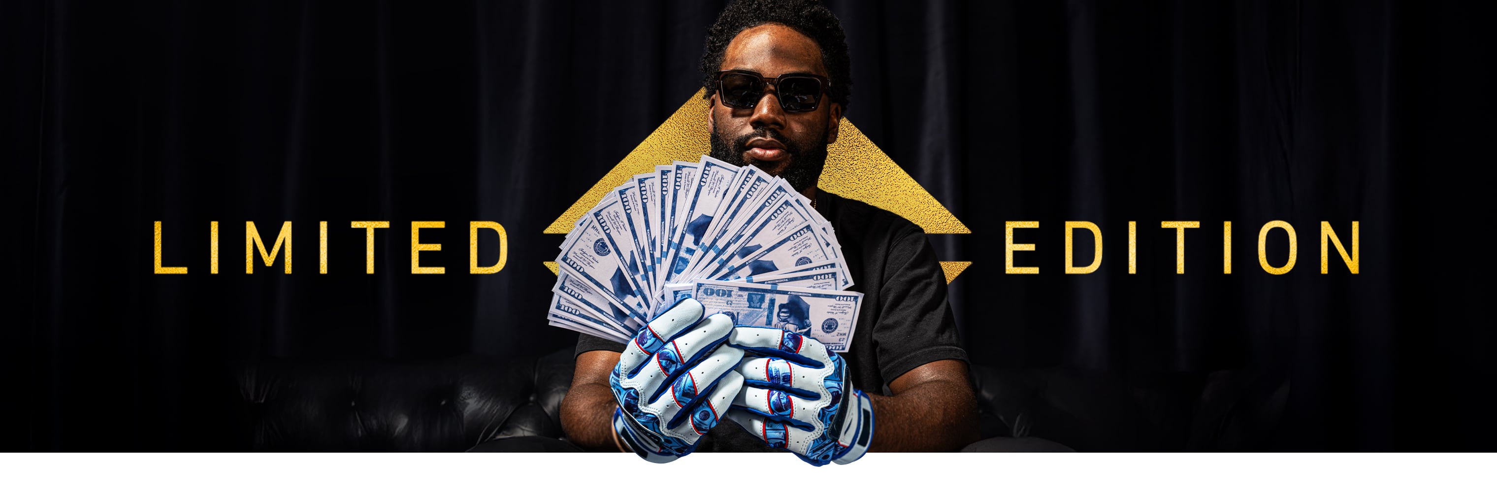 Michael Harris II wearing his limited-edition batting gloves and holding a fan of cash in front of a gold Limited Edition logo