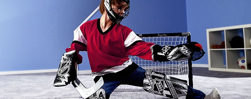 youth goalie playing mini hockey