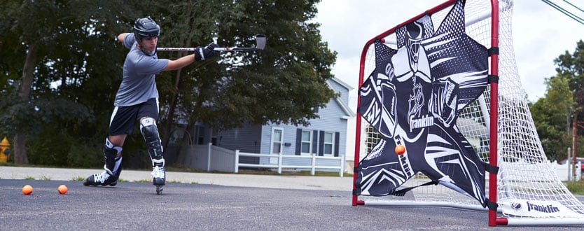 street hockey player shooting on net with target
