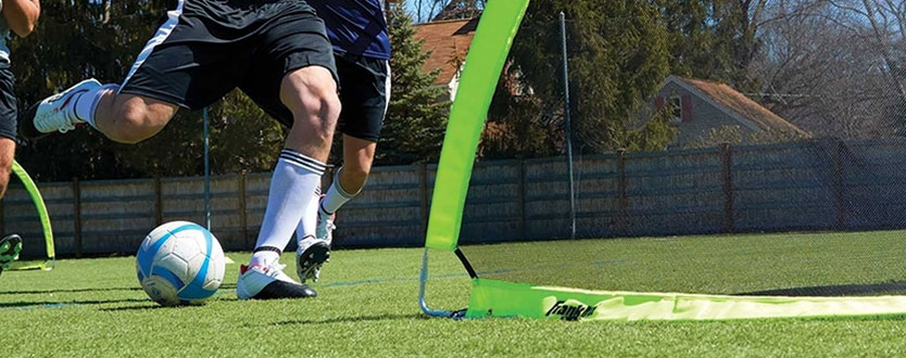 soccer player kicking soccer ball
