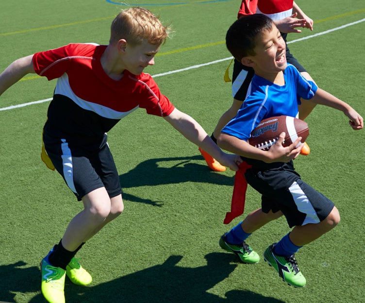 boys playing flag football
